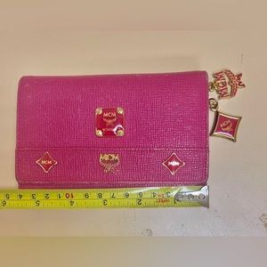 Preowned Authentic MCM beautiful trifold short studded leather wallet.